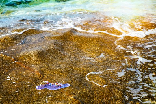 Sardegna, La Maddalena, flip flops at the beach, moment for relaxing at the sea, Italy