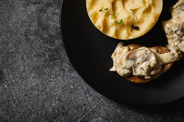 baked potatoes with pork medallions