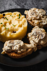 baked potatoes with pork medallions