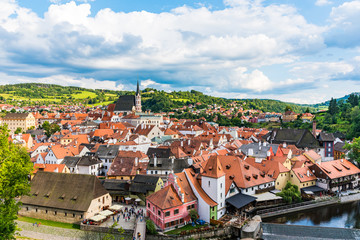 Fototapeta na wymiar Aerial view on the old city in Czech Republic located between the green mountains and a river