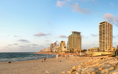 Central beach of Tel Aviv on sunny day. Seascape and skyscrapers, Israel.