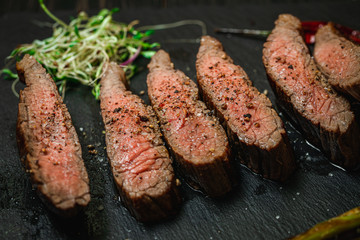 grilled steak on a wooden board