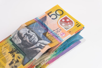 Obraz na płótnie Canvas stack of australian dollar bills on white background