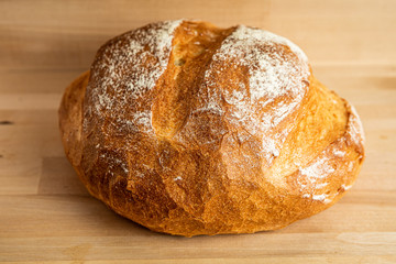 loaf of bread on wooden table