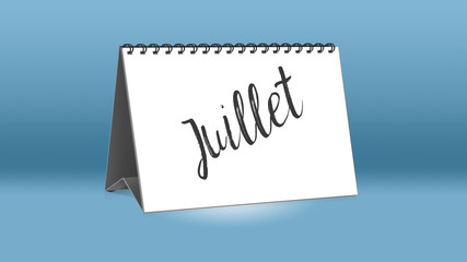 Ein Kalender für den Schreibtisch zeigt den französischen Monat Juillet (Juli in deutscher Sprache)