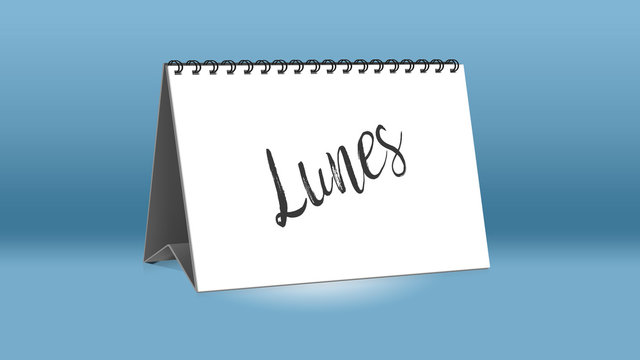Ein Kalender für den Schreibtisch zeigt den spanischen Wochentag Lunes (Montag in deutscher Sprache)