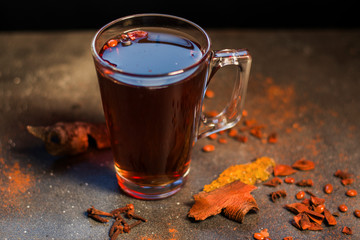 Grog in the cup, tea and rum with cinnamon and clove  