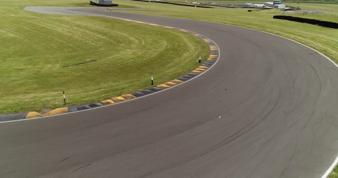 Corner on race track with curb and tyre marks