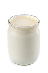 Georgian matsoni yoghurt in a glass pot isolated on white background
