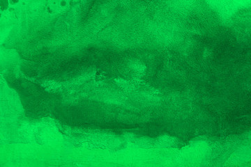 Gently green background for text.  Blurred green background. Wet green sheet of paper with stains. Wet green stains.