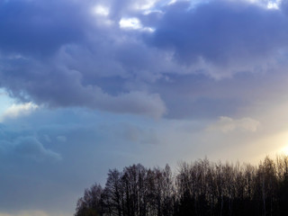 Fototapeta premium Dark and white clouds on a background of blue sky
