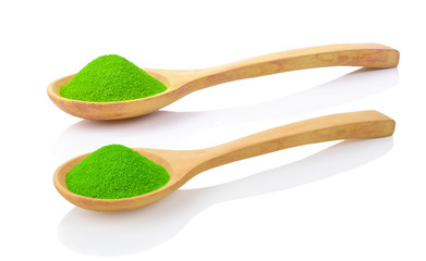 Matcha word by powdered matcha green tea with wooden spoon