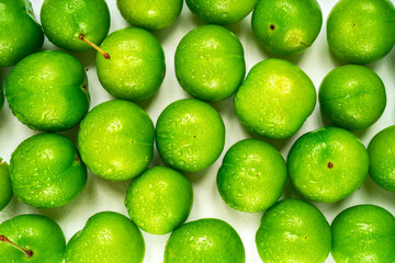 Green sour plum. Greengage on isolated on white background. Top view. Copy space for text message.