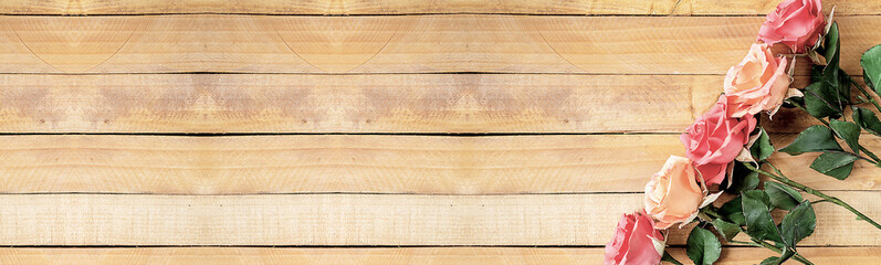Handmade roses layout on wooden background. Background layout with free text space.
