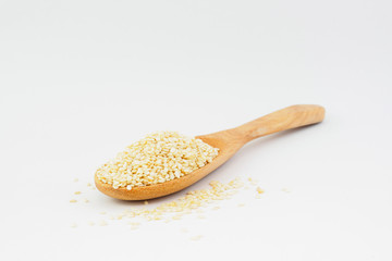 White sesame seeds in a spoon