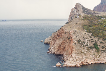 Local tourism in Crimea. Cliffs And Water. Skyes rocks, rocks, & lochs. Seascape of Cape Fiolent,...