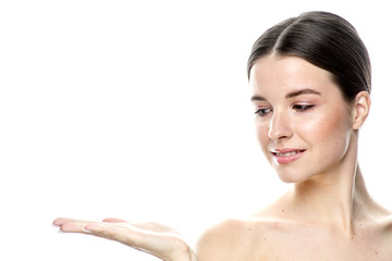 A close-up portrait of a girl with freckles and clear skin. Light blue eyes. The girl has different emotions, she looks at the camera. Isolated on a white background 