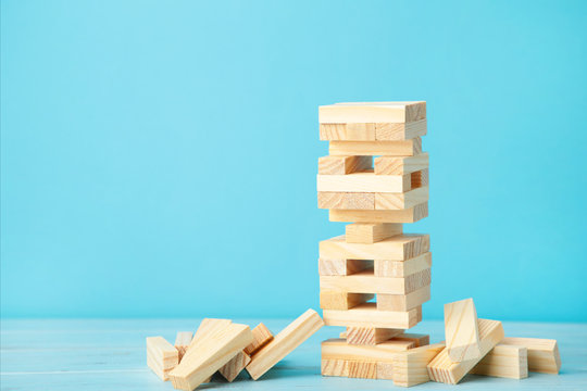 Business Risk Concept With Wood Jenga Game. Top View