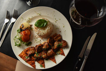 Kebabs served with vegetables and rice