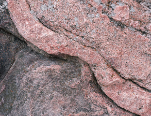 abstract background surface of natural stone with a reddish structure and relief
