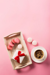 Rose french cookies macaroons on pink background