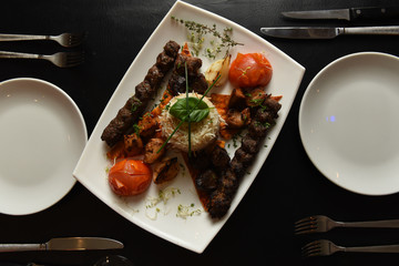 Kebabs served with vegetables and rice