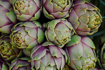 Group of artichokes. Healthy fresh artichokes are grown on an organic farm. Royalty high-quality free stock image of vegetables. Food background