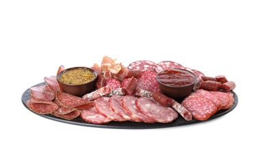 Slices of different sausages with sauce isolated on white