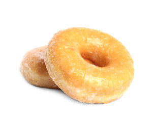 Sweet delicious glazed donuts on white background