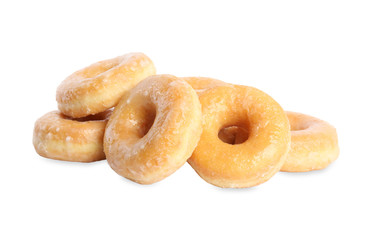 Sweet delicious glazed donuts on white background