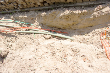 Excavated underground cables in the street in Elst, Netherlands