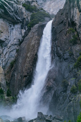 waterfall in Yosemite National Park in sunny weather blue sky with clouds