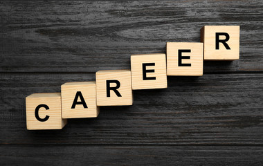 Cubes with word CAREER on wooden background, flat lay