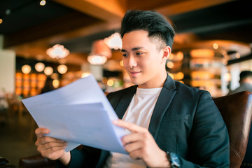 young Business man  Working and study In Coffee Shop