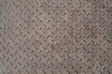 Old industrial metal plate with diamond pattern. Texture. Background.
