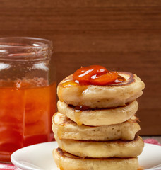 pancakes with apricot jam on a wooden background. Food for Breakfast in the morning. recipe for pancakes. selective focus and copy space. home cooking recipe