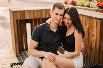 Loving couple hugging in the street.