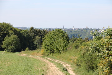 Fototapeta na wymiar road in the field with view of Solingen 