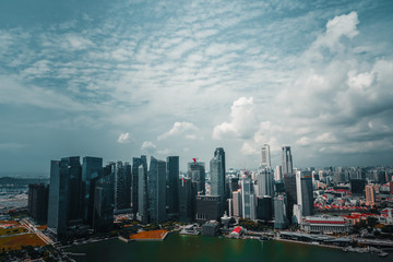 Fototapeta na wymiar BAYFRONT AVE / SINGAPORE - DECEMBER 2019: Amazing view of tall buildings from the Sands SkyPark Observation Deck, Singapore. 