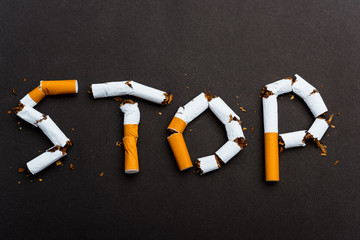 31 May of World No Tobacco Day, no smoking close up word STOP spelled text of the pile cigarette or...