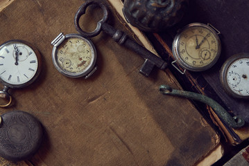 Fototapeta na wymiar vintage pocket watch and old book