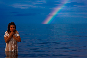 naked young woman and rainbow