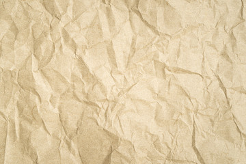 Texture of a crumpled sheet of old paper as a background