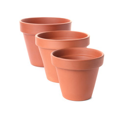 Stylish terracotta flower pots isolated on white