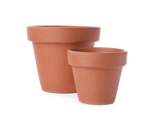 Stylish terracotta flower pots isolated on white