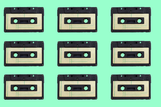vintage audio cassettes pattern  on a green background