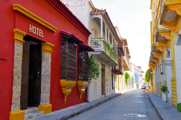 Walking the narrow and colorful streets with historic old buildings with wooden balconies and urban...