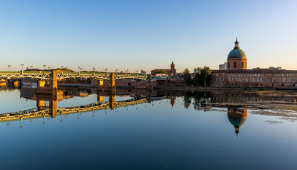 Beautiful reflection of the Saint Pierre bridge and Saint Joseph Dome in the River Garonne, Toulouse