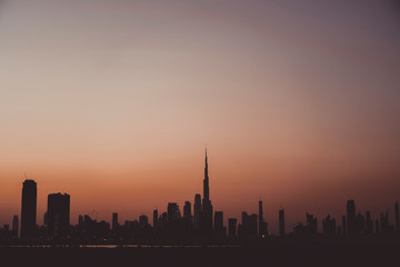 Amazing Dubai skyline silhouette during sunset