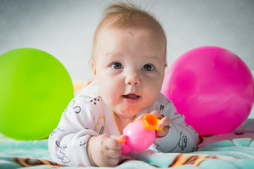 Fototapeta na wymiar Beautiful little baby girl with balloons. Good mood